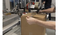 Worker seals a case using Shurtape's rPET packaging tape