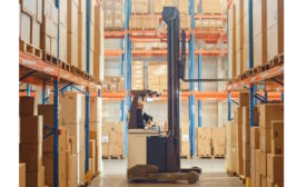 Person operating forklift in warehouse