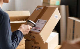 Image of someone scanning a label on a box